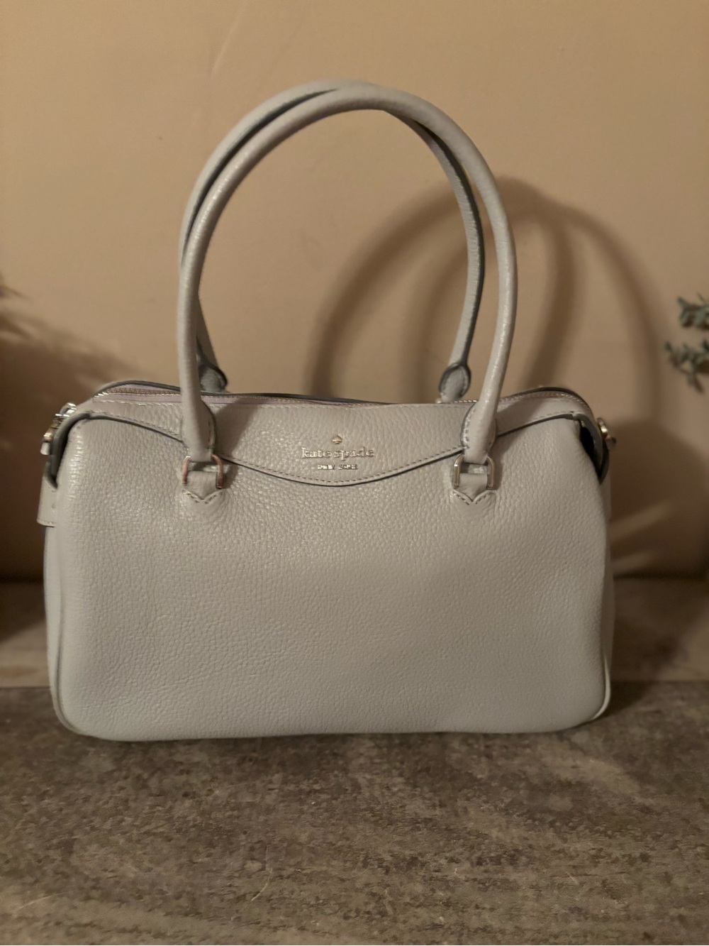 kate spade pale gray pebbled leather dome crossbody handbag
New without tag